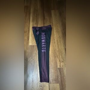 Hogwarts Purple & Black Leggings are a size Large.